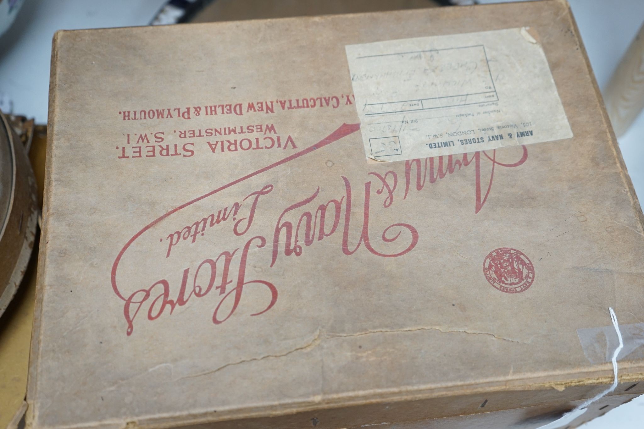 An Army & Navy Stores Ltd. grey top hat and a Christys of London black riders bowling hat, both boxed